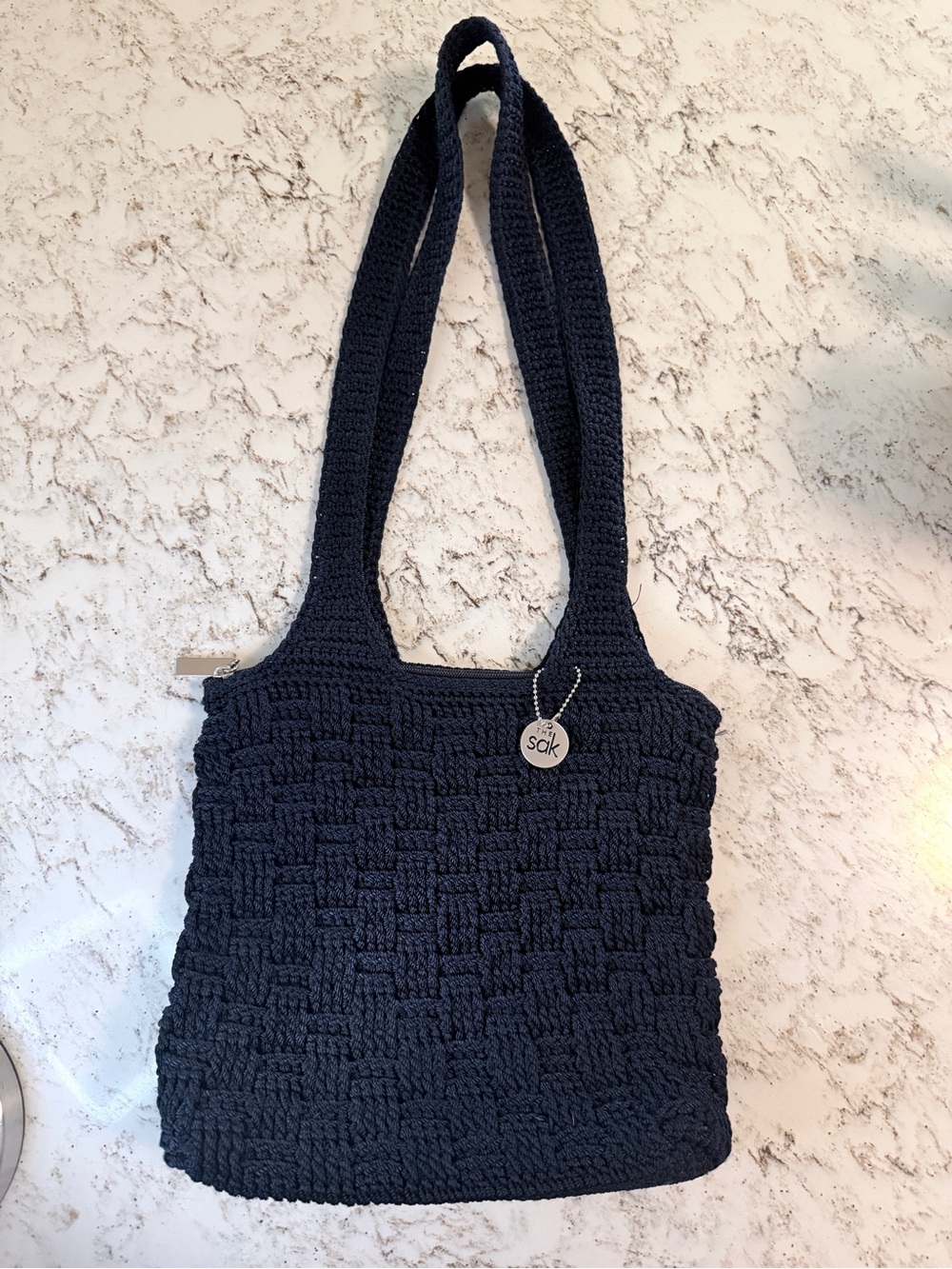 The Sak Navy Blue Crochet Shoulder Bag with Signature Charm
